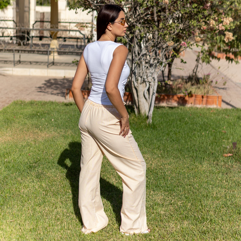 بنطال واسع الساقين بخصر عالٍ من قماش البوبلين الأصفر المخطط من لا رين 